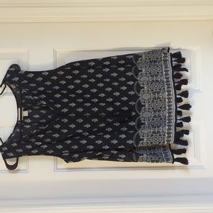 Large black and white loft tank with tassels